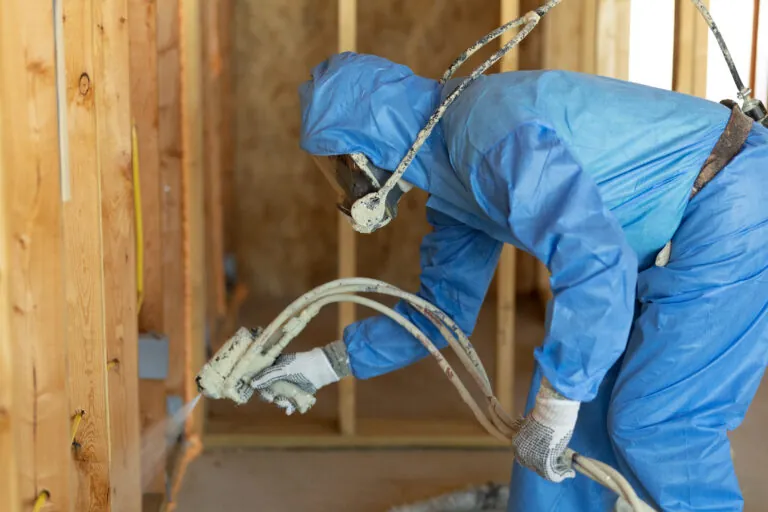 Man installing spray foam insulation in Beaumont, TX