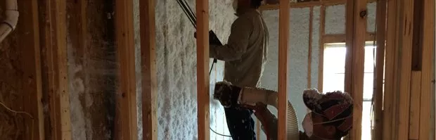 Spray foam insulation being installed in the walls of a new build home